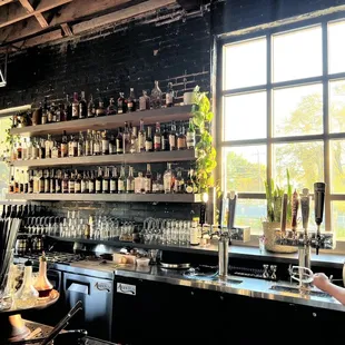 a woman standing at a bar