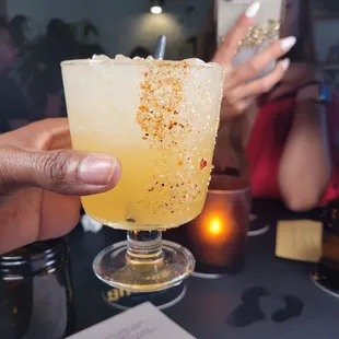 a person taking a picture of a drink