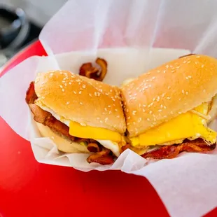 two sandwiches on a red table