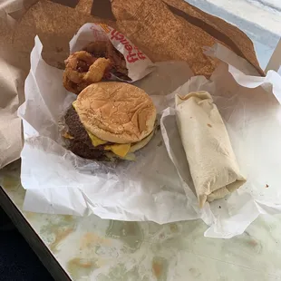 Bacon breakfast burrito , dbl cheese burger and onion ring