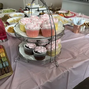 Vanilla, lemon, strawberry and chocolate cupcakes with soft pink icing