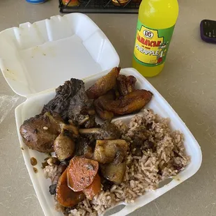 Brown stew chicken, rice and peas, plantains