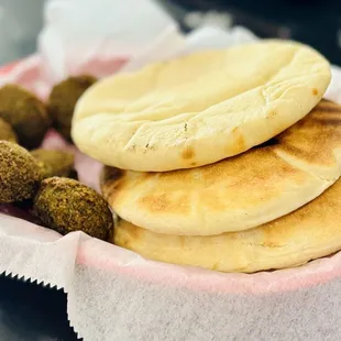 three pita breads in a basket