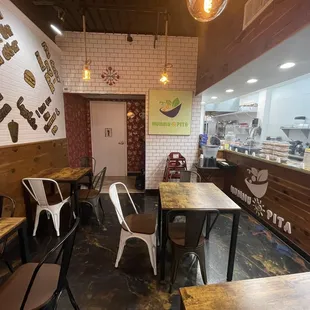 an empty restaurant with tables and chairs