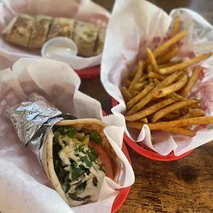 Falafel pita hummus sandwich &amp; chicken schwarma sandwich in the back