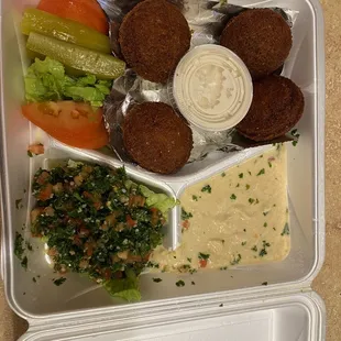 a tray of hummus and vegetables