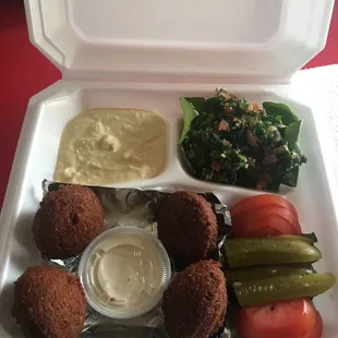 Vegetarian Falafel plate comes with hummus tabouli salad tahini sause and pita bread