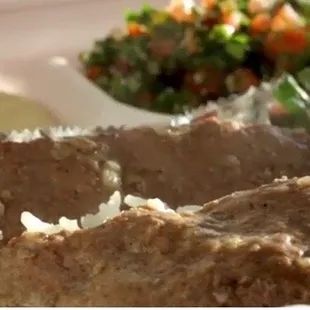 Kafta kabab beef plate with Lebanese rice tabouli hummus salad and pita bread