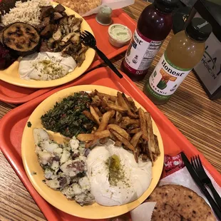 Combination platter (left) and platter with tabouli, Potato Salad, and hummus (right)