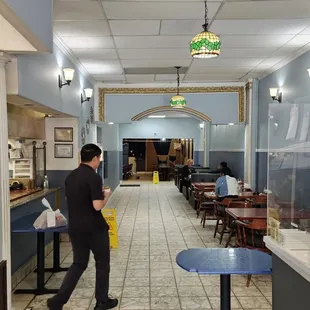 a man cleaning a restaurant
