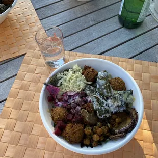 Build Your Own Bowl: Falafel, Hummus, tapenade, Dolmades, eggplant, cucumbers, roasted chickpeas, spinach