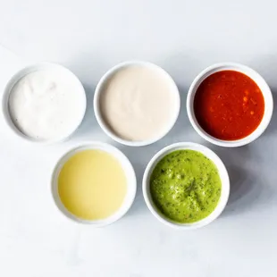 a variety of sauces in small bowls