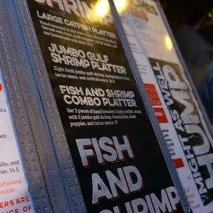 a menu for fish and shrimp