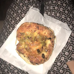 Cheese and green chili bagel with cream cheese