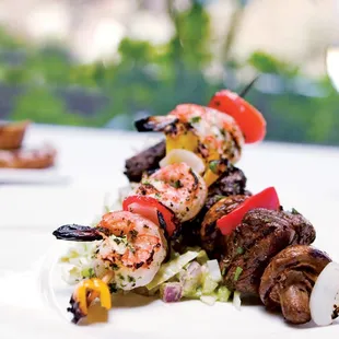 Surf &amp; Turf Skewers - Grilled Filet Mignon &amp; Mexican Gulf shrimp, with peppers &amp; mushrooms, endive, red onion &amp; cucumber salad