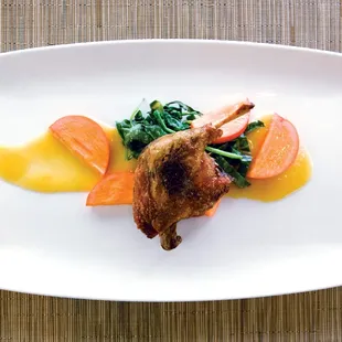 Duck Confit - Sauteed seasonal greens, grilled Fuyu persimmons, spiced orange reduction.