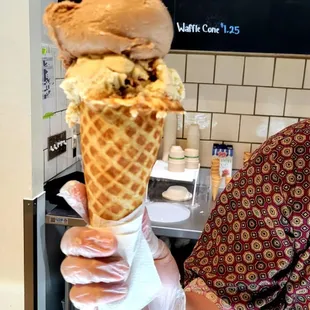 My yummy Salted Caramel Cocoa Nibs, and Peanut Butter Fudge Ripple scoops on a Waffle Cone.