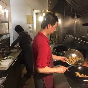 Mr. Lee cooking general tso chicken for Fort Riley&apos;s best!