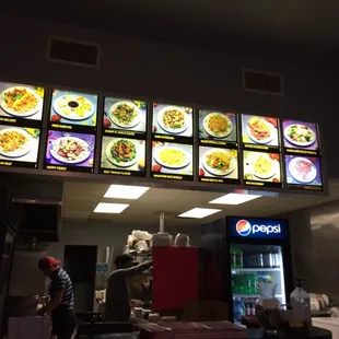 a restaurant with menus on the wall
