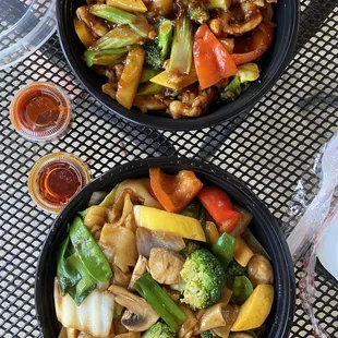Hunan chicken top, vegetable flat noodle (chow fun) bottom.