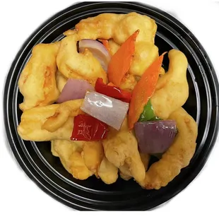 a black plate of fried food