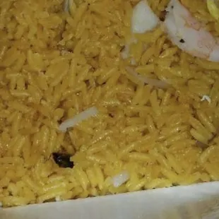 a plate of rice and shrimp