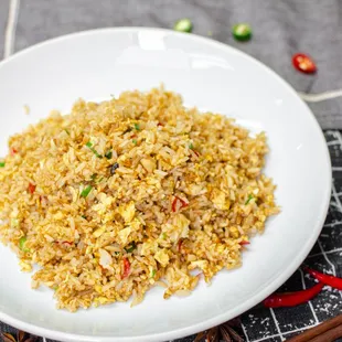 plate of fried rice with chopsticks