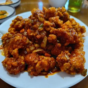 Boneless fried chicken thighs in a hot and sweet sauce.