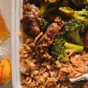 Beef and broccoli with fried rice.