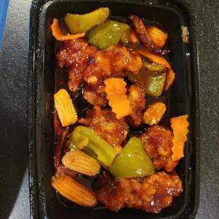 a black container of chinese food