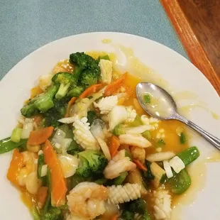 Squid shrimp In a spicy ginger white sauce with veggies