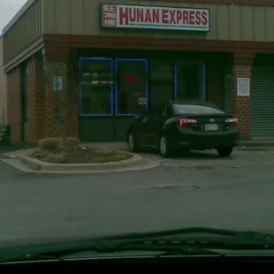 a car parked in front of a building