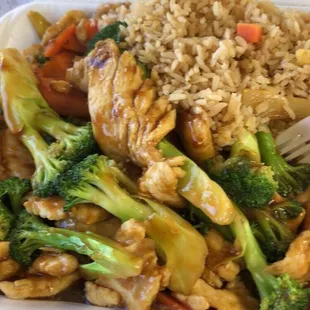 chicken, broccoli, and rice in a styrofoam container