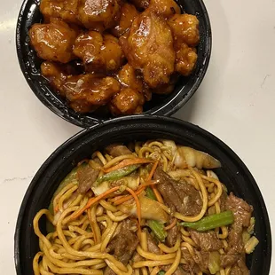 two bowls of noodles and meat