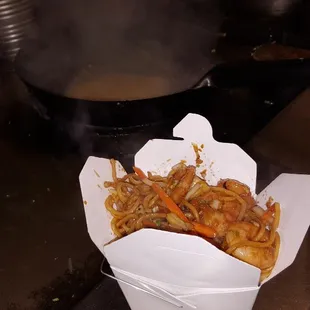 Cooking your orders in our open kitchen. We use fresh ingredents cooked to your requests. Visit us at Hunan Family, Columbia, MD.
