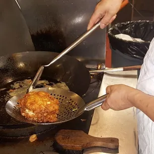 Making an order of Vegetarian Egg Foo Young in our open kitchen. Fresh ingredents  made to your order. Hunan Family