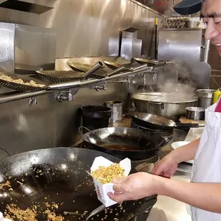 Preparing a Vegetarian Fried Rice in our open kitchen. You can watch us add the fresh ingredients and make your order. 
HUNAN FAMILY