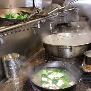 Cooking fresh steamed veggies in our open kitchen. Vegetarians dream at Hunan Family Wilde Lake Village Center, Columbia, MD