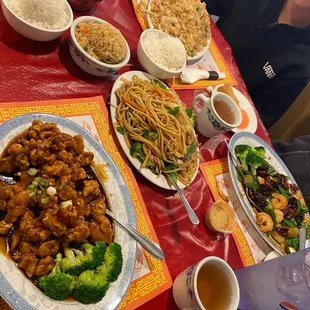 Orange chicken, chicken fried rice, veggie Lo mein, wonton soup, walnut shrimp, hot tea, spring rolls, steamed rice and fried rice.