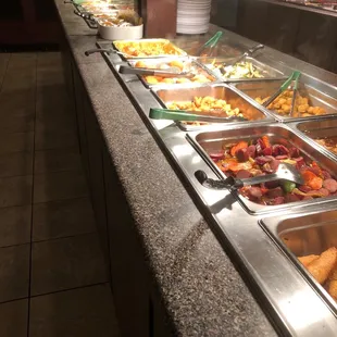 a buffet with a variety of food items