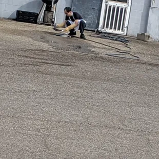Hunan garden washing cooking materials in a puddle out back the restaurant. Yum..........