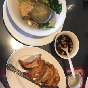 Pot stickers part of the dinner for 2,  and sizzling rice (left over after our first serving).