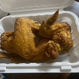 chicken wings in a styrofoam container