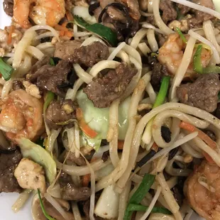 Yaki-udon Japanese soba noodles stir-fried with white meat chicken, shrimp, and beef along with vegetables.