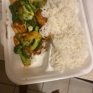 a tray of rice, broccoli, and chicken