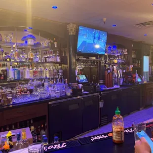 a bar with a television in the background