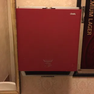 A touchless dispenser in the men&apos;s bathroom