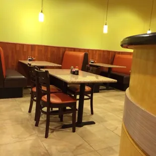 a restaurant with tables and booths