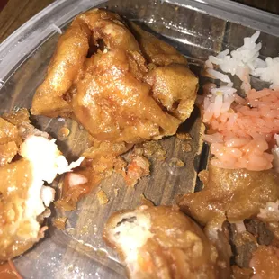chicken, shrimp, and rice in a plastic container