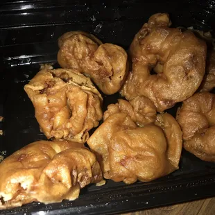 a close up of a tray of fried food